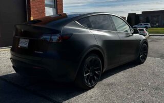 tesla model y wrapped in 3m satin black 2080