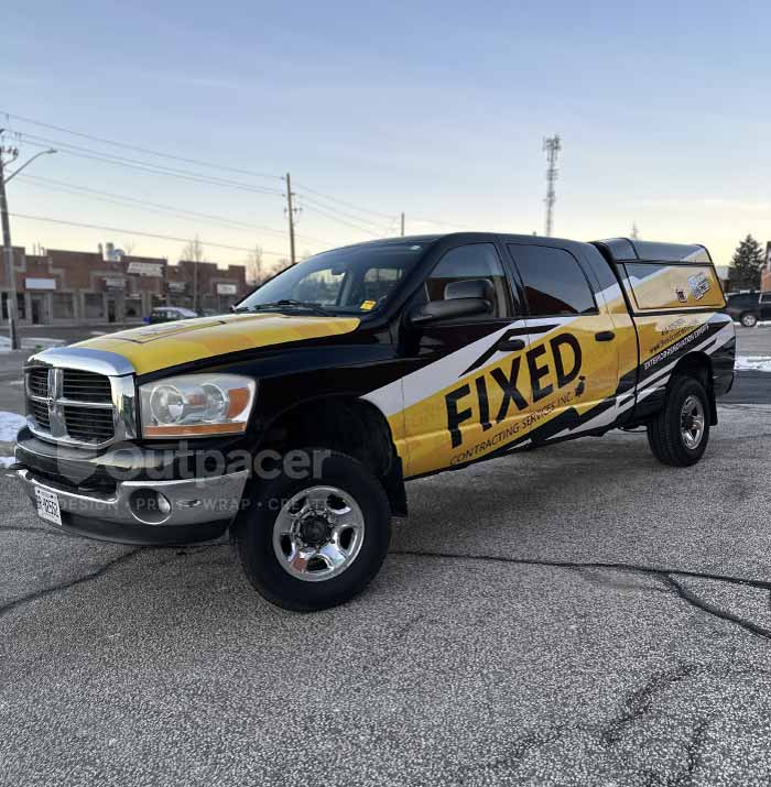 dodge ram with custom yellow vinyl wrap by outpacer