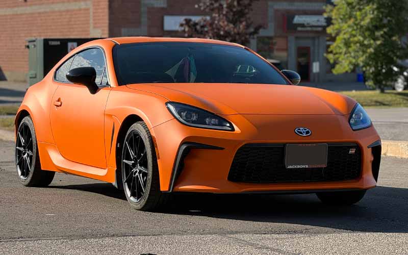 Toyota GR86 wrapped in Avery Matte Orange by Outpacer